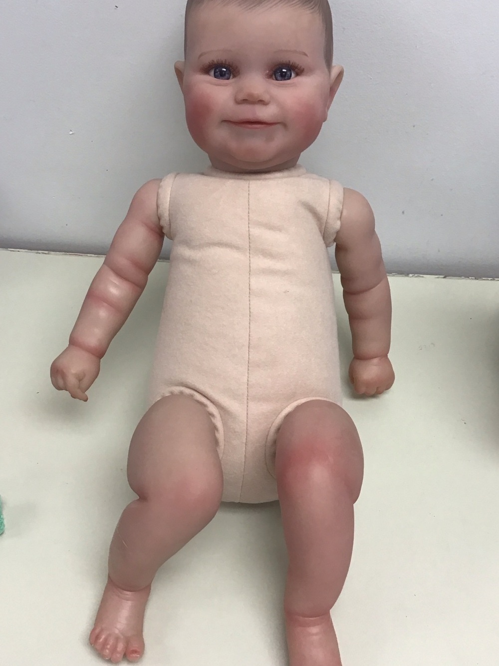 Reborn “Maddy” Beige Fabric Body Baby Doll with Vinyl Limbs